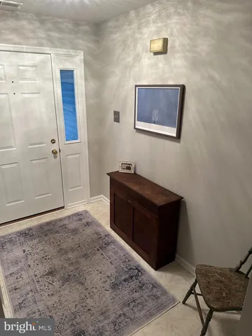 a room with a bed and a dresser