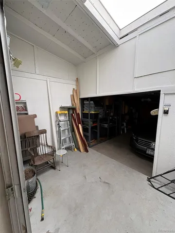 a view of an empty room with furniture