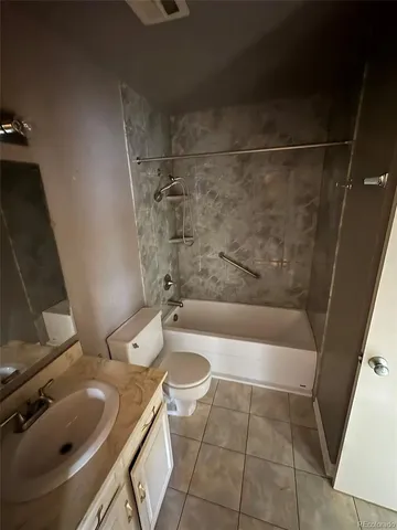 a bathroom with a sink a toilet and bathtub