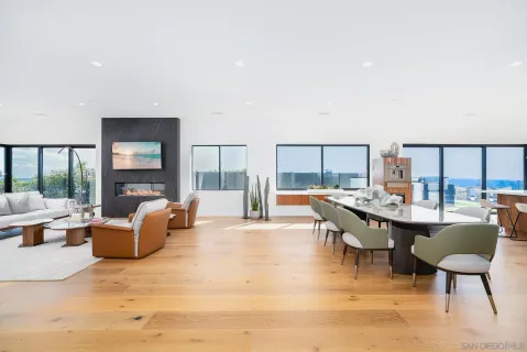 a dining room with furniture and window