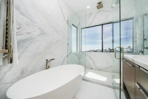 a view of a room with furniture and window