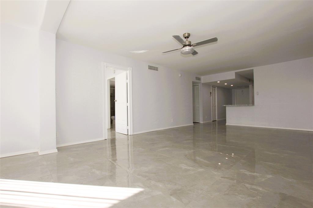 3100 North Course Lane, Unit 103 Pompano Beach, FL 33069 - Photo 16 of 51 a view of a livingroom with a ceiling fan