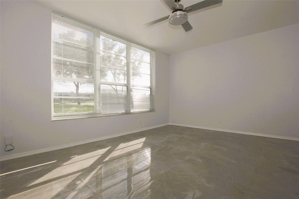3100 North Course Lane, Unit 103 Pompano Beach, FL 33069 - Photo 27 of 51 a view of an empty room with a window
