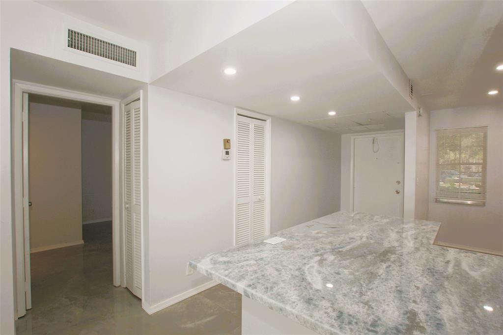 3100 North Course Lane, Unit 103 Pompano Beach, FL 33069 - Photo 32 of 51 a view of a livingroom with a hallway