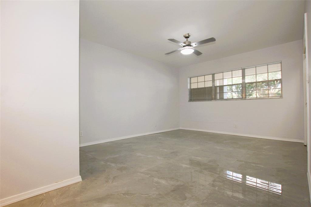 3100 North Course Lane, Unit 103 Pompano Beach, FL 33069 - Photo 33 of 51 a view of an empty room with a window