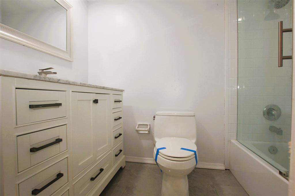 3100 North Course Lane, Unit 103 Pompano Beach, FL 33069 - Photo 39 of 51 a bathroom with a toilet sink and shower