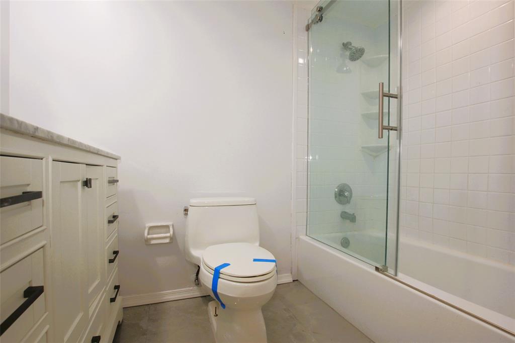 3100 North Course Lane, Unit 103 Pompano Beach, FL 33069 - Photo 40 of 51 a bathroom with a toilet and a shower