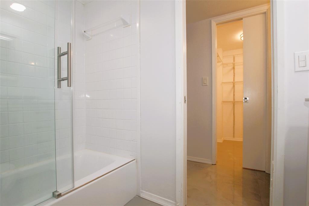 3100 North Course Lane, Unit 103 Pompano Beach, FL 33069 - Photo 42 of 51 a bathroom with a bathtub