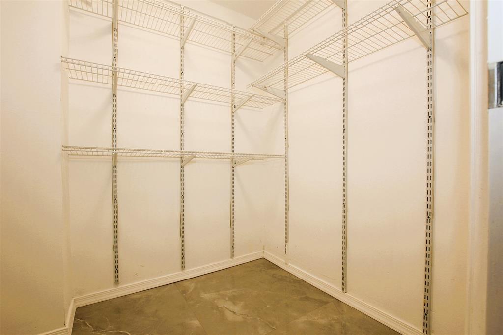 3100 North Course Lane, Unit 103 Pompano Beach, FL 33069 - Photo 43 of 51 a view of a room with racks on the wall