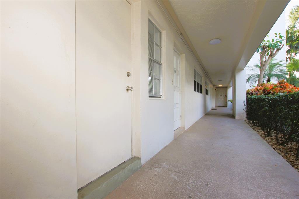 3100 North Course Lane, Unit 103 Pompano Beach, FL 33069 - Photo 48 of 51 a view of a house with a hallway