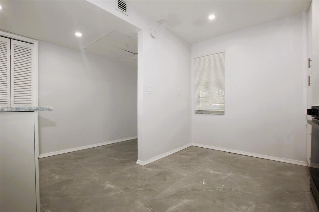 3100 North Course Lane, Unit 103 Pompano Beach, FL 33069 - Photo 7 of 51 an empty room with windows