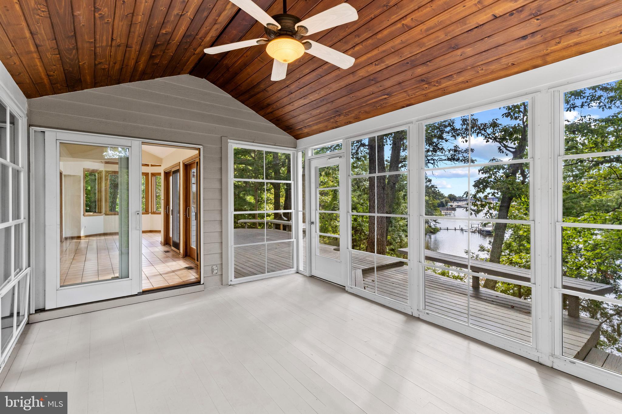 105 Wallace Manor Road Edgewater, MD 21037 - Photo 10 of 35 a view of an empty room with windows