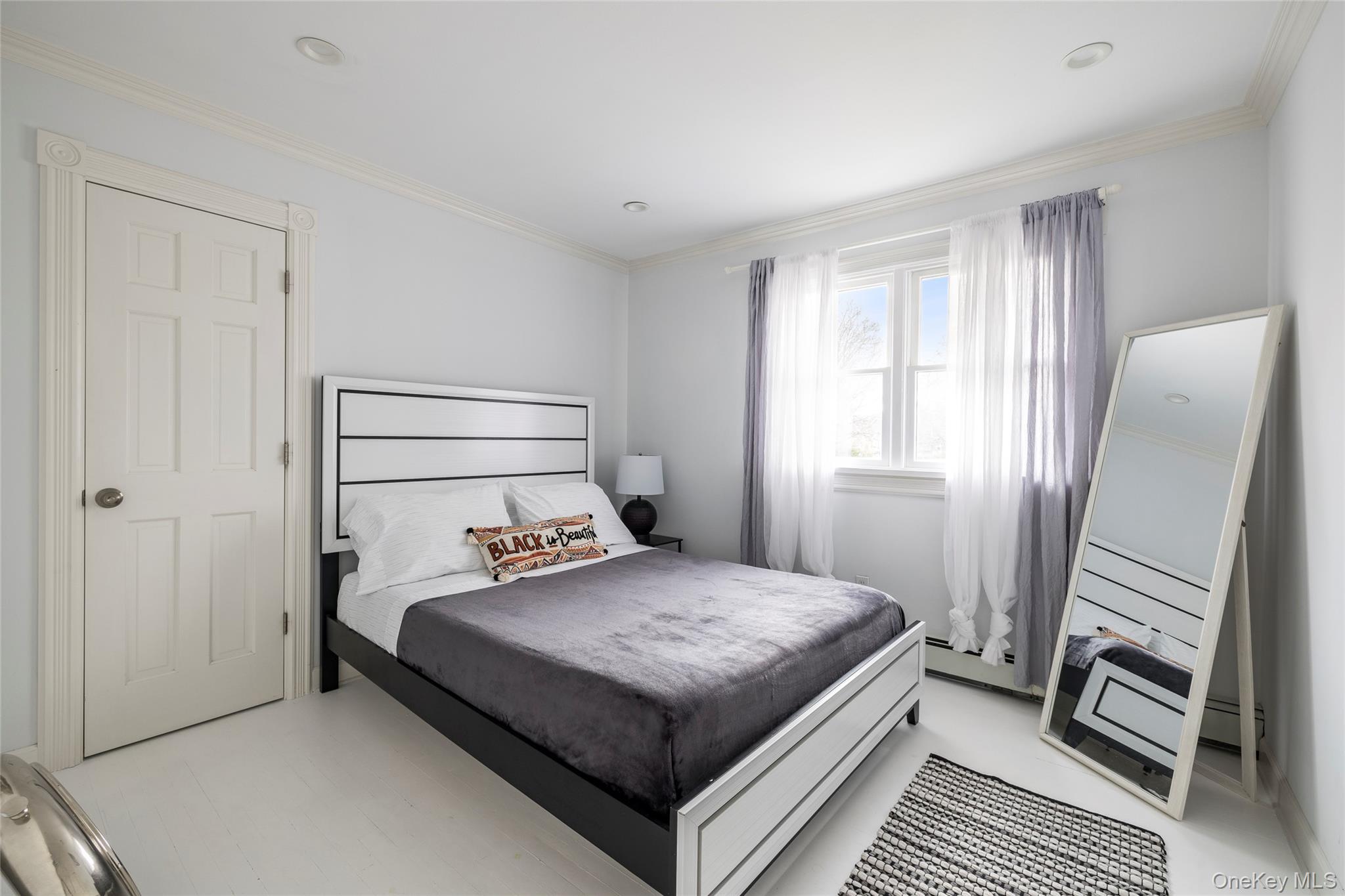 8 Westerly Court Hampton Bays, NY 11946 - Photo 16 of 26 a bedroom with a bed and a dresser