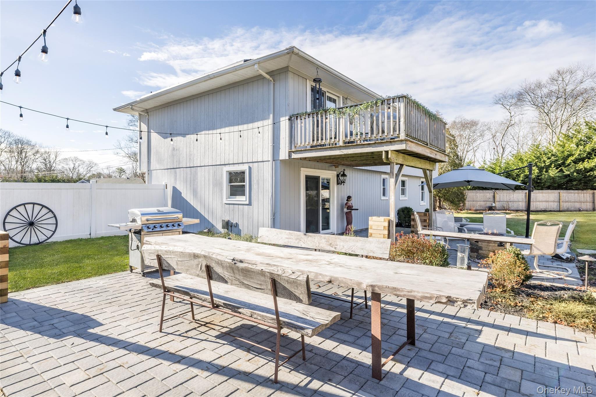 8 Westerly Court Hampton Bays, NY 11946 - Photo 22 of 26 a view of a house with pool porch and wooden floor