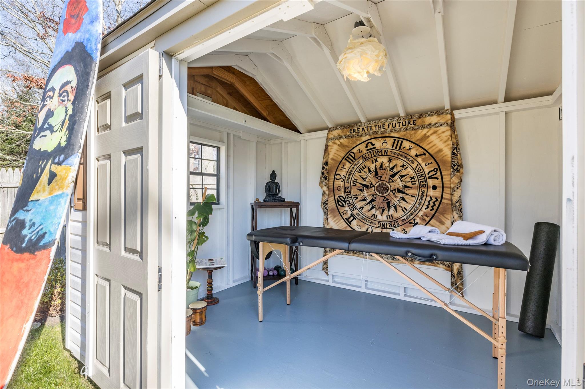 8 Westerly Court Hampton Bays, NY 11946 - Photo 23 of 26 a view of entryway with a table and chairs