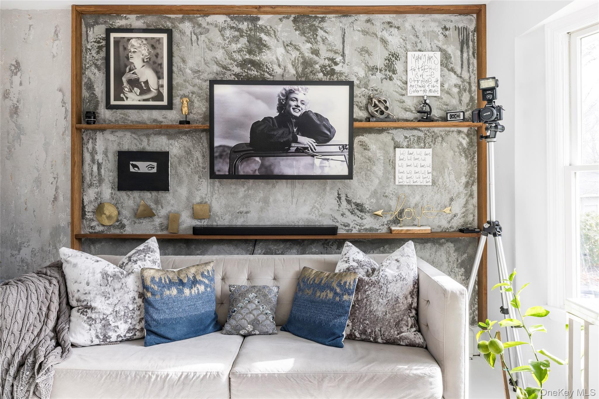 8 Westerly Court Hampton Bays, NY 11946 - Photo 9 of 26 a living room with furniture and painting on the wall