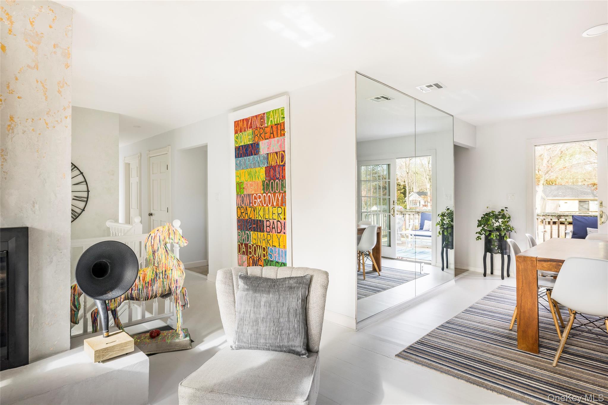 8 Westerly Court Hampton Bays, NY 11946 - Photo 10 of 26 a living room with furniture and wooden floor
