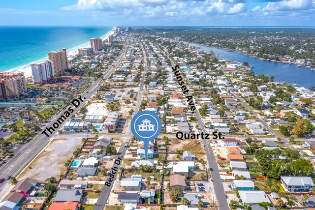 an aerial view of a house with a lake view