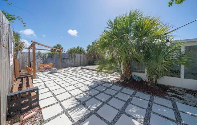 an aerial view of multiple houses with yard