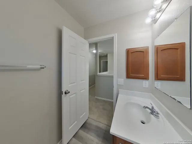 a bathroom with a sink and shower