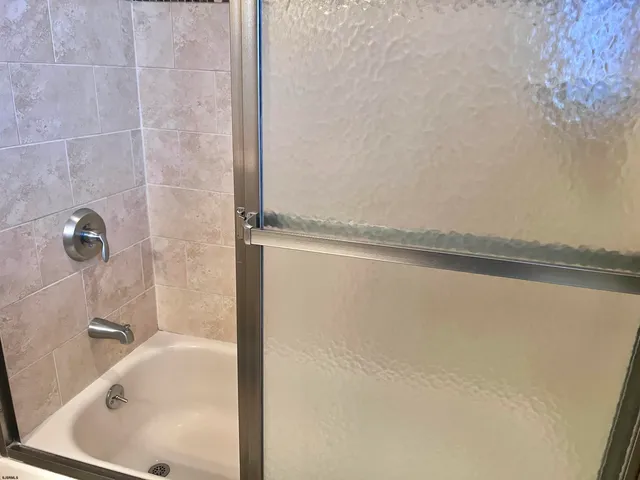 a bathroom with a bath tub