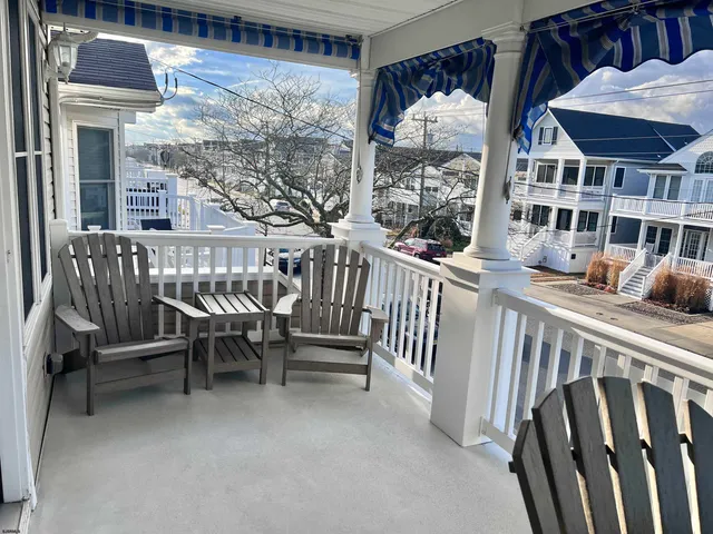 a view of a balcony with chairs