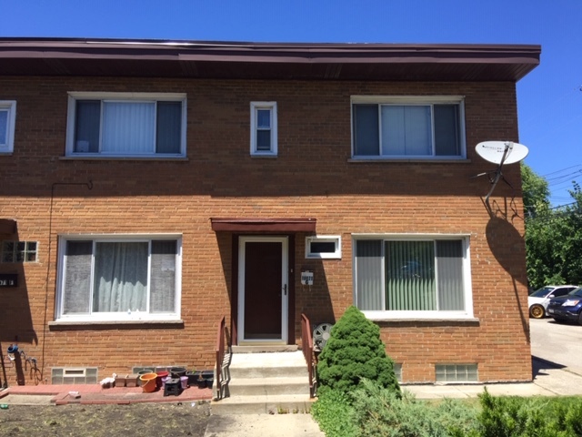 10071 Frontage Road, Unit G Skokie, IL 60077 - Photo 1 of 22 a front view of a house