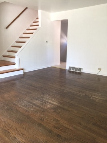 10071 Frontage Road, Unit G Skokie, IL 60077 - Photo 2 of 22 a view of a room with wooden floor