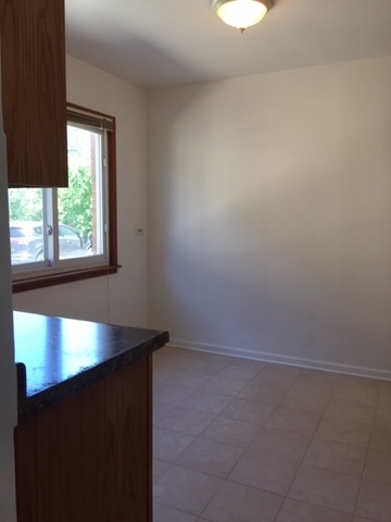 10071 Frontage Road, Unit G Skokie, IL 60077 - Photo 12 of 22 an empty room with a window