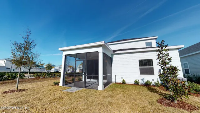 a view of a house with backyard and porch