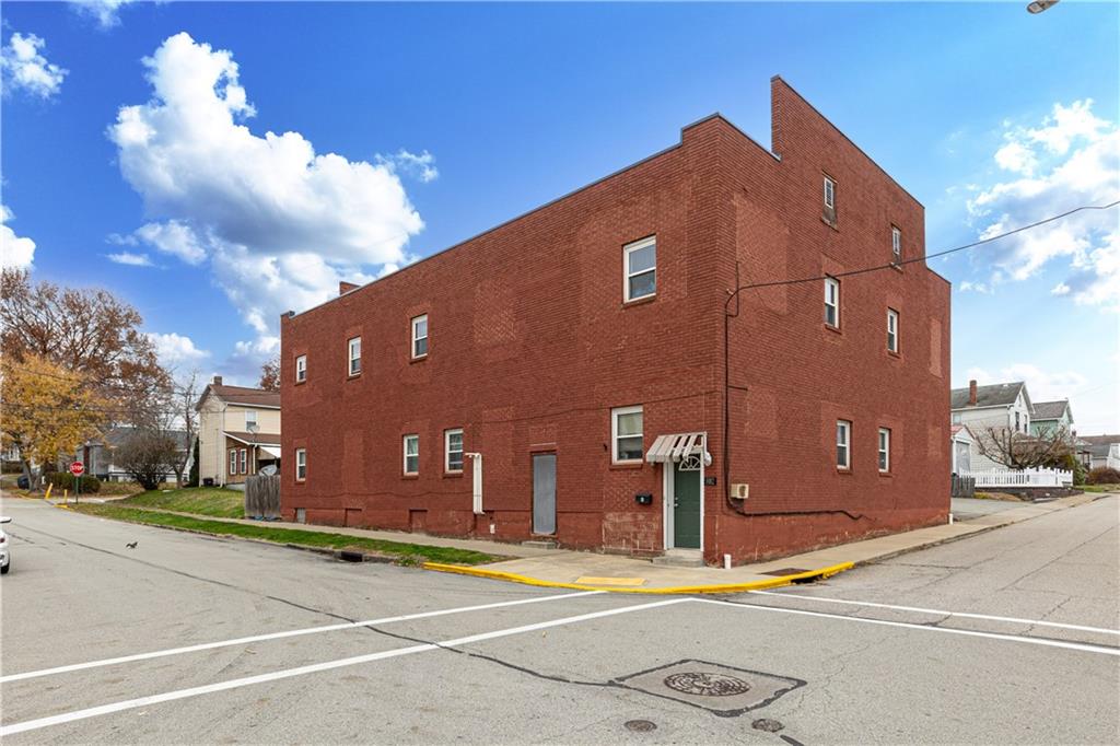 a view of a building with a street
