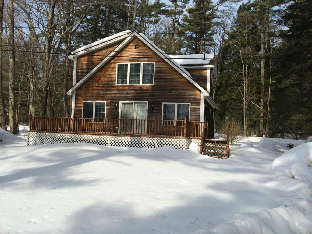 128 Cove Road Auburn, ME 04210 - Photo 2 of 31 The home sits on a level lot with a...