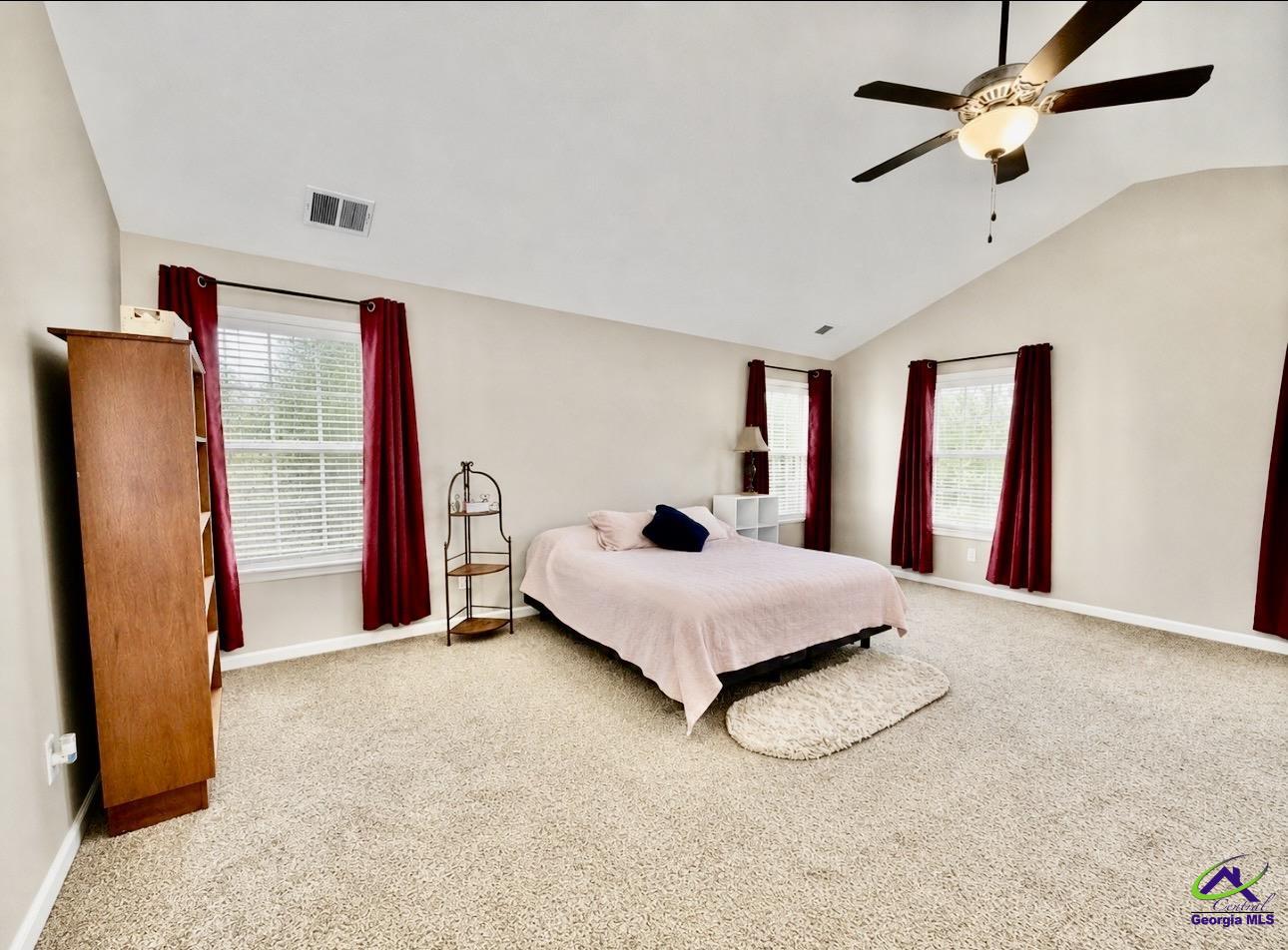 600 Post Oak Way Warner Robins, GA 31088 - Photo 30 of 50 a bedroom with a bed and a dresser