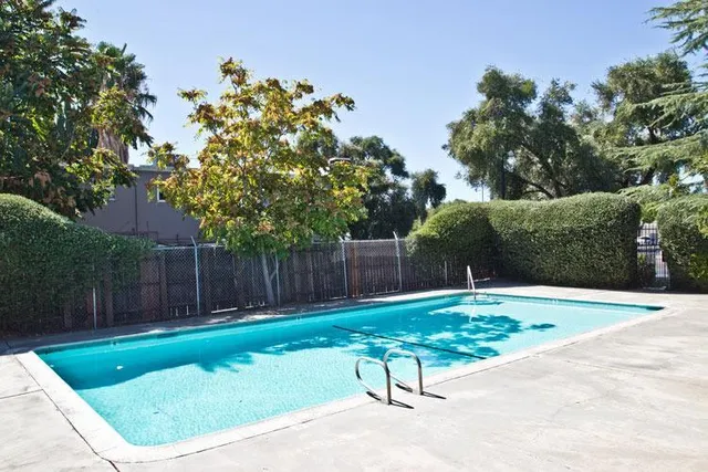 a view of a backyard with a small pool