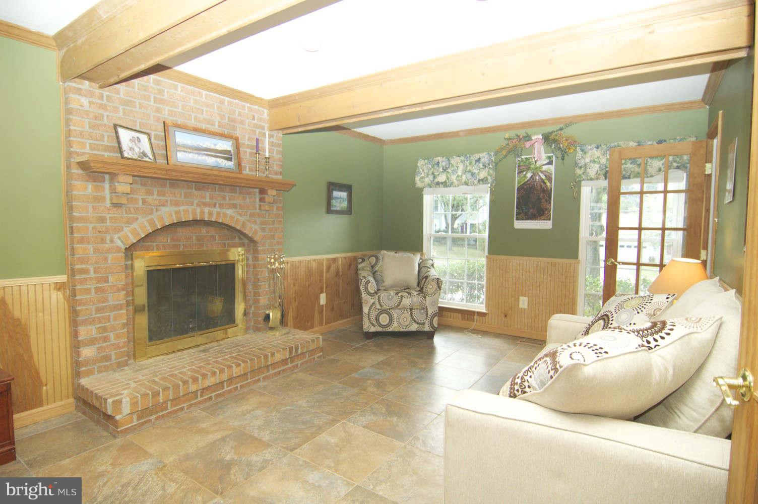 934 Pointer Ridge Drive Gaithersburg, MD 20878 - Photo 12 of 30 centered firepl, stone tile floor, wainscoting...