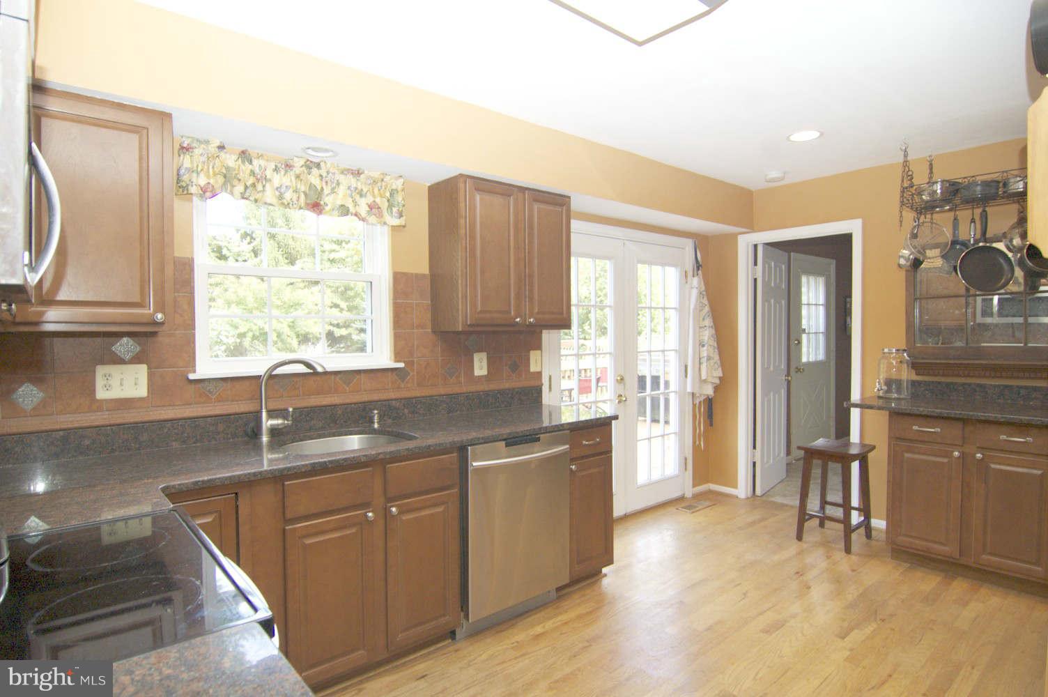 934 Pointer Ridge Drive Gaithersburg, MD 20878 - Photo 9 of 30 Granite eating island, French doors to Deck & Laun