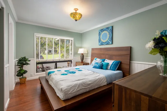 a bedroom with a bed and a table