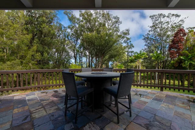 a view of a chairs and table in the patio