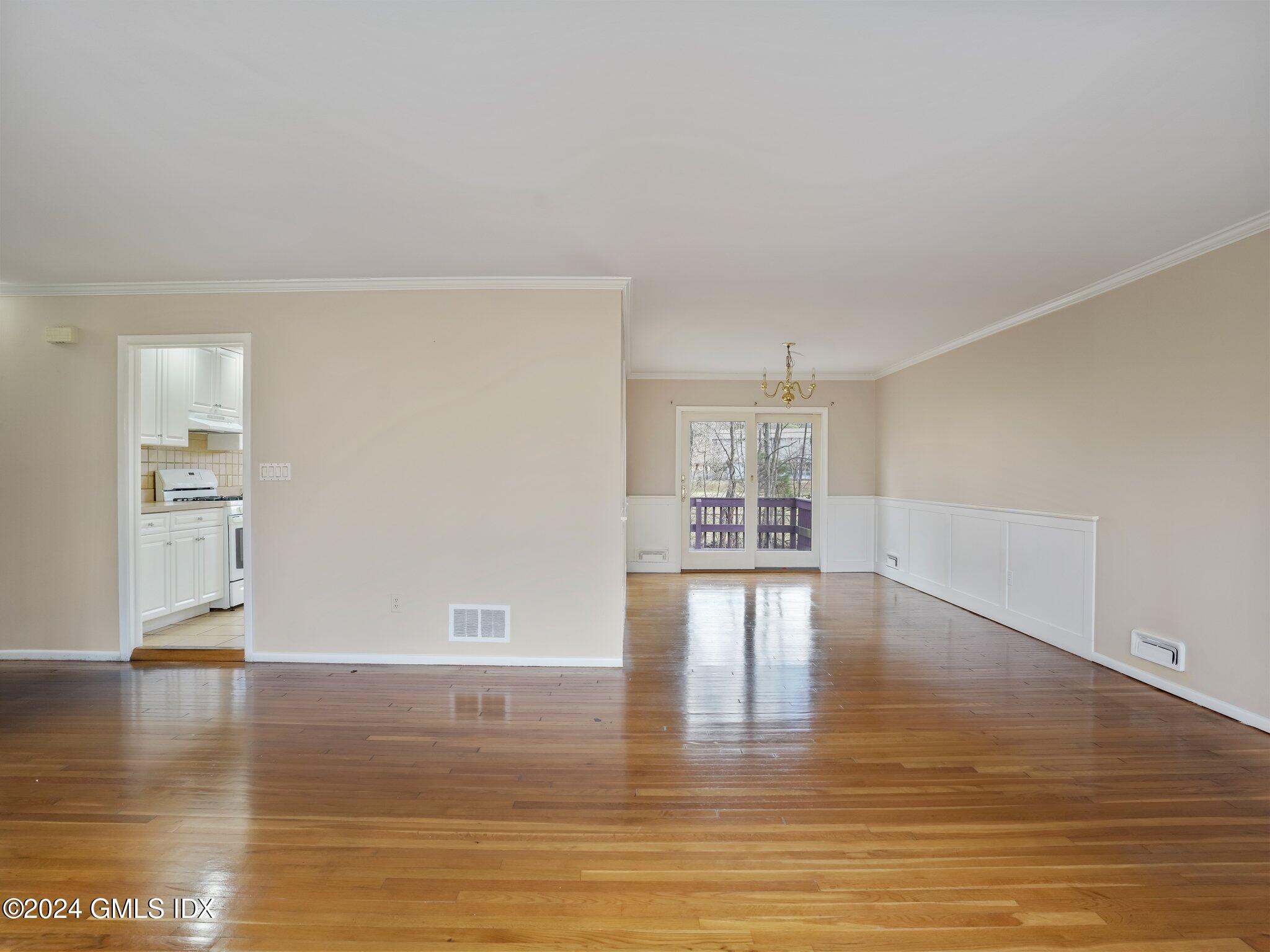 59 Lancer Road Riverside, CT 06878 - Photo 4 of 13 a view of empty room with wooden floor