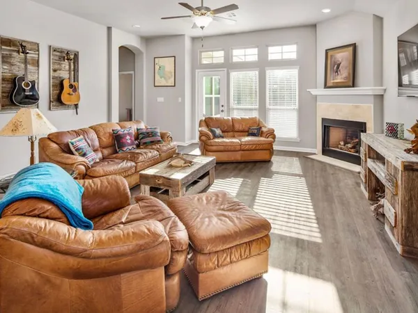 a living room with furniture fireplace and a fireplace