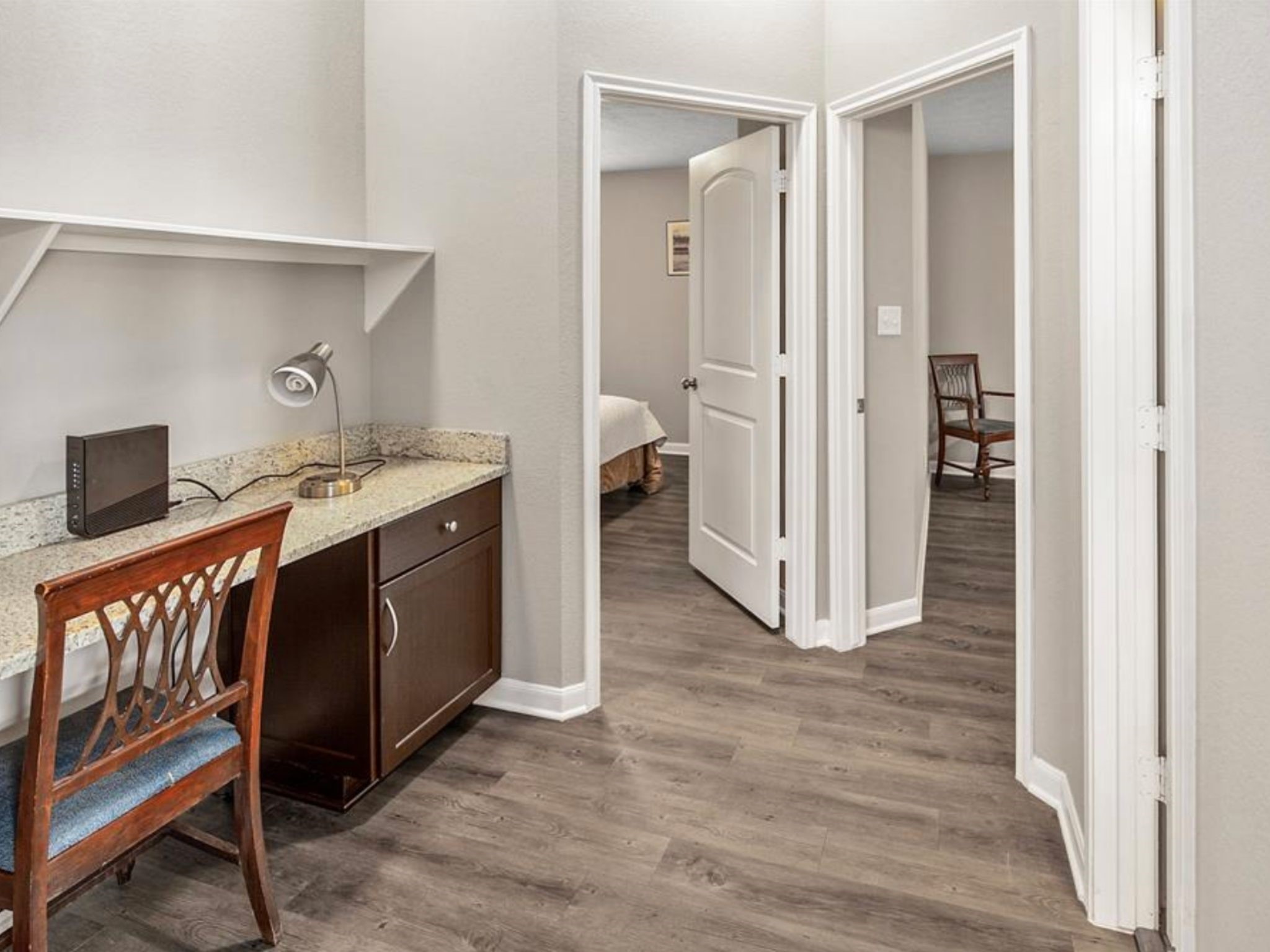 2025 Jester Trail Bryan, TX 77807 - Photo 19 of 24 a view of a hallway with wooden floor and entryway