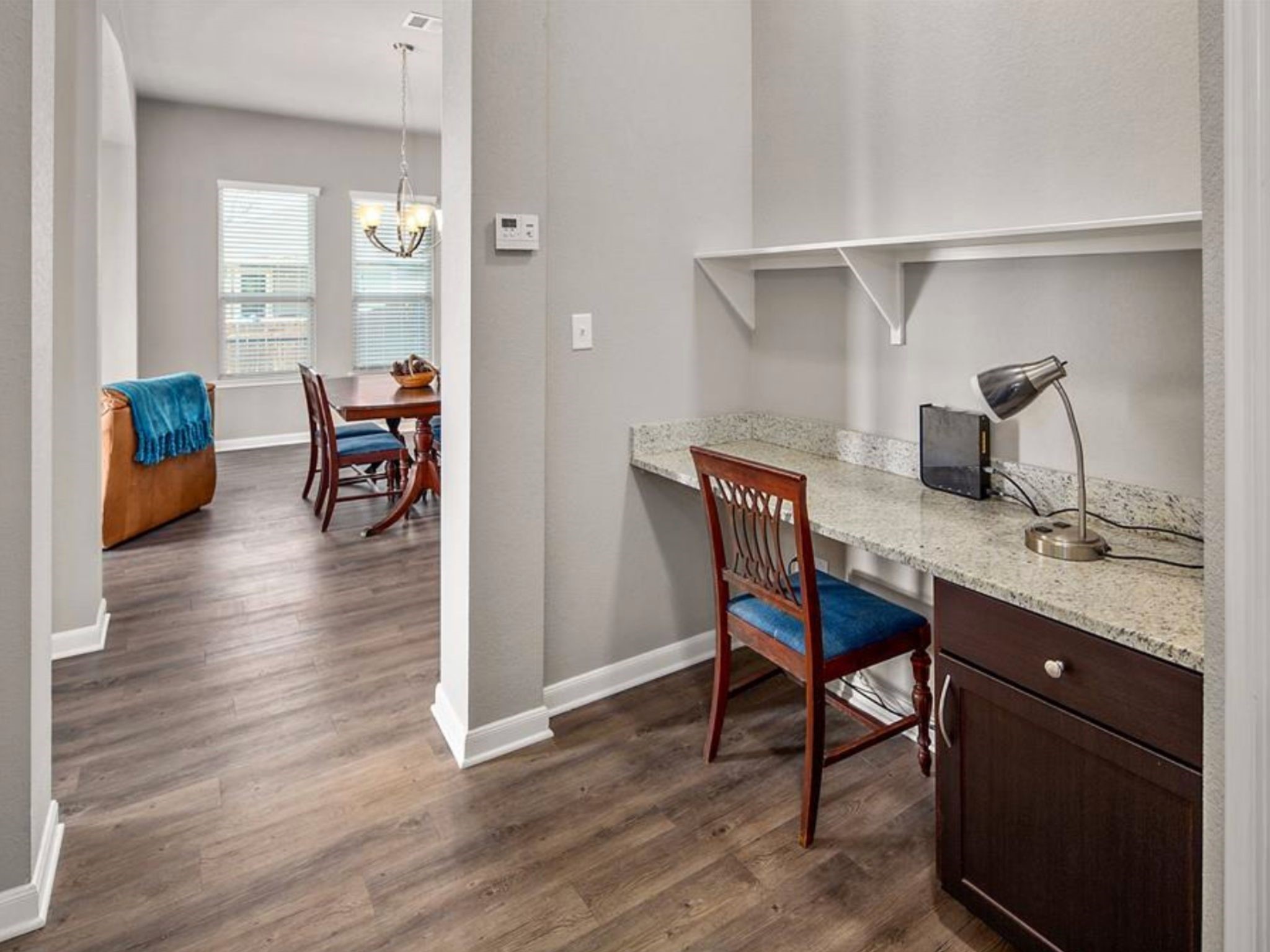 2025 Jester Trail Bryan, TX 77807 - Photo 20 of 24 a view of a dining room with furniture and wooden floor