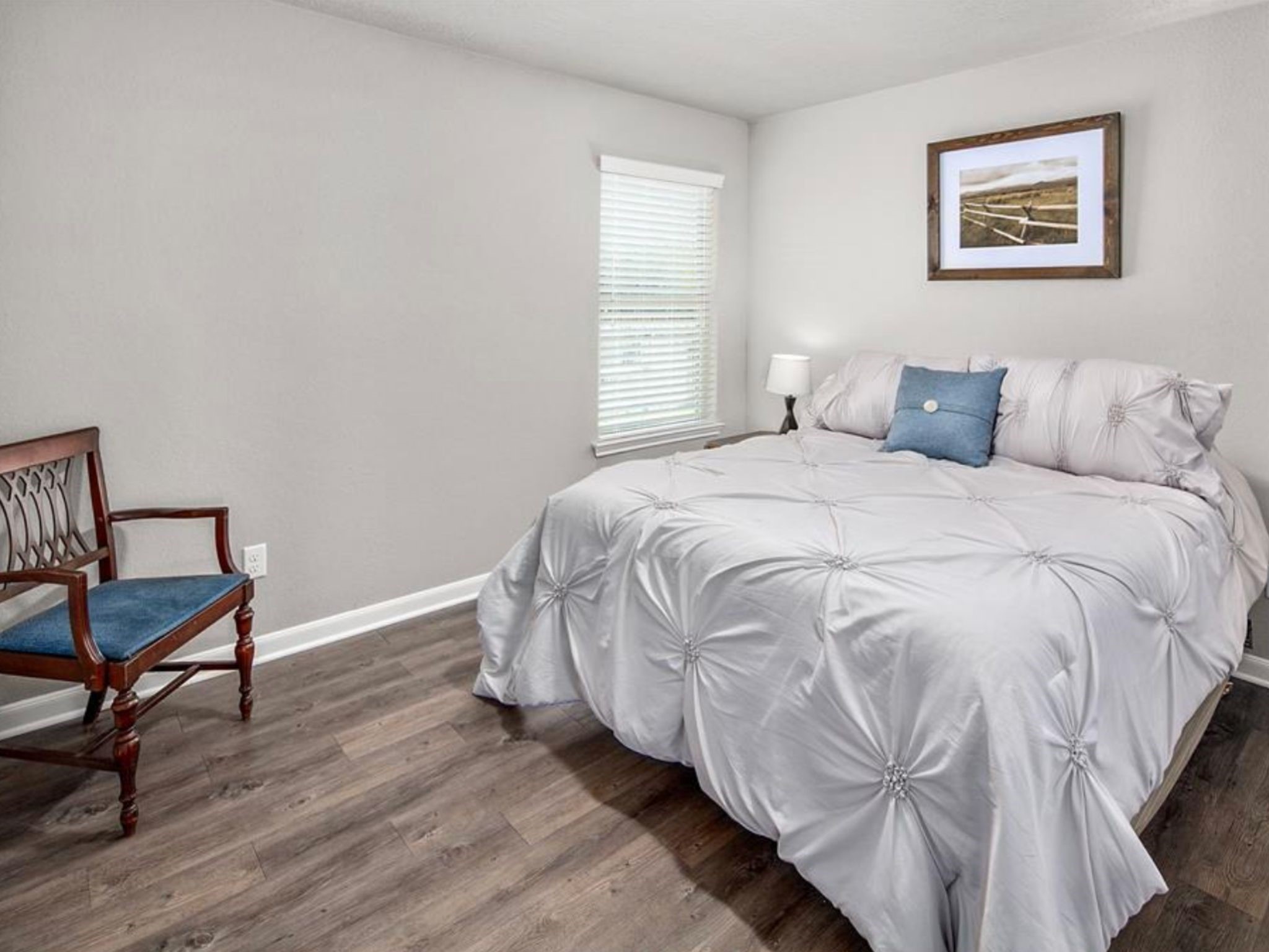 2025 Jester Trail Bryan, TX 77807 - Photo 21 of 24 a bedroom with a bed and a chair
