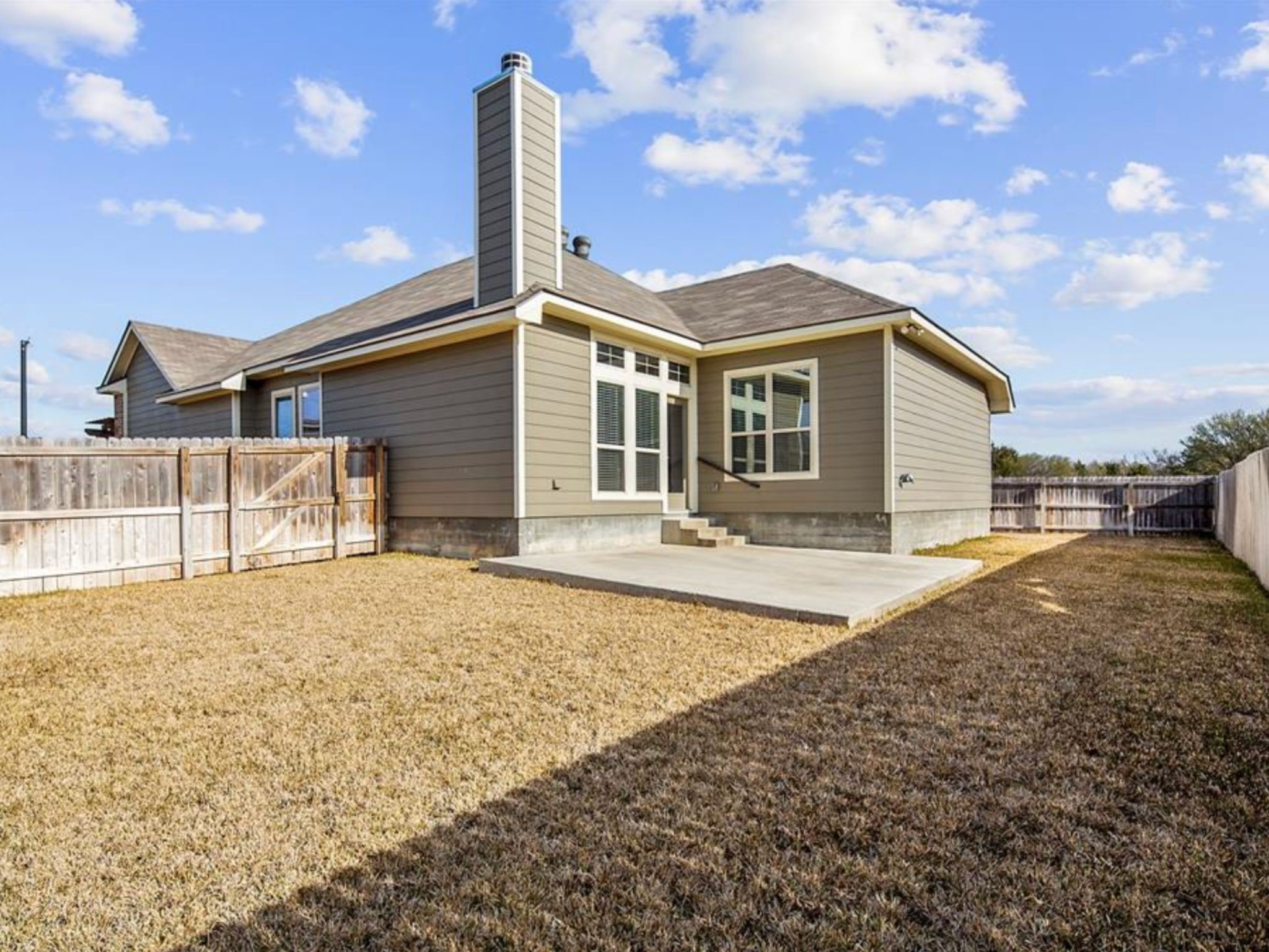 2025 Jester Trail Bryan, TX 77807 - Photo 23 of 24 a front view of a house with a yard