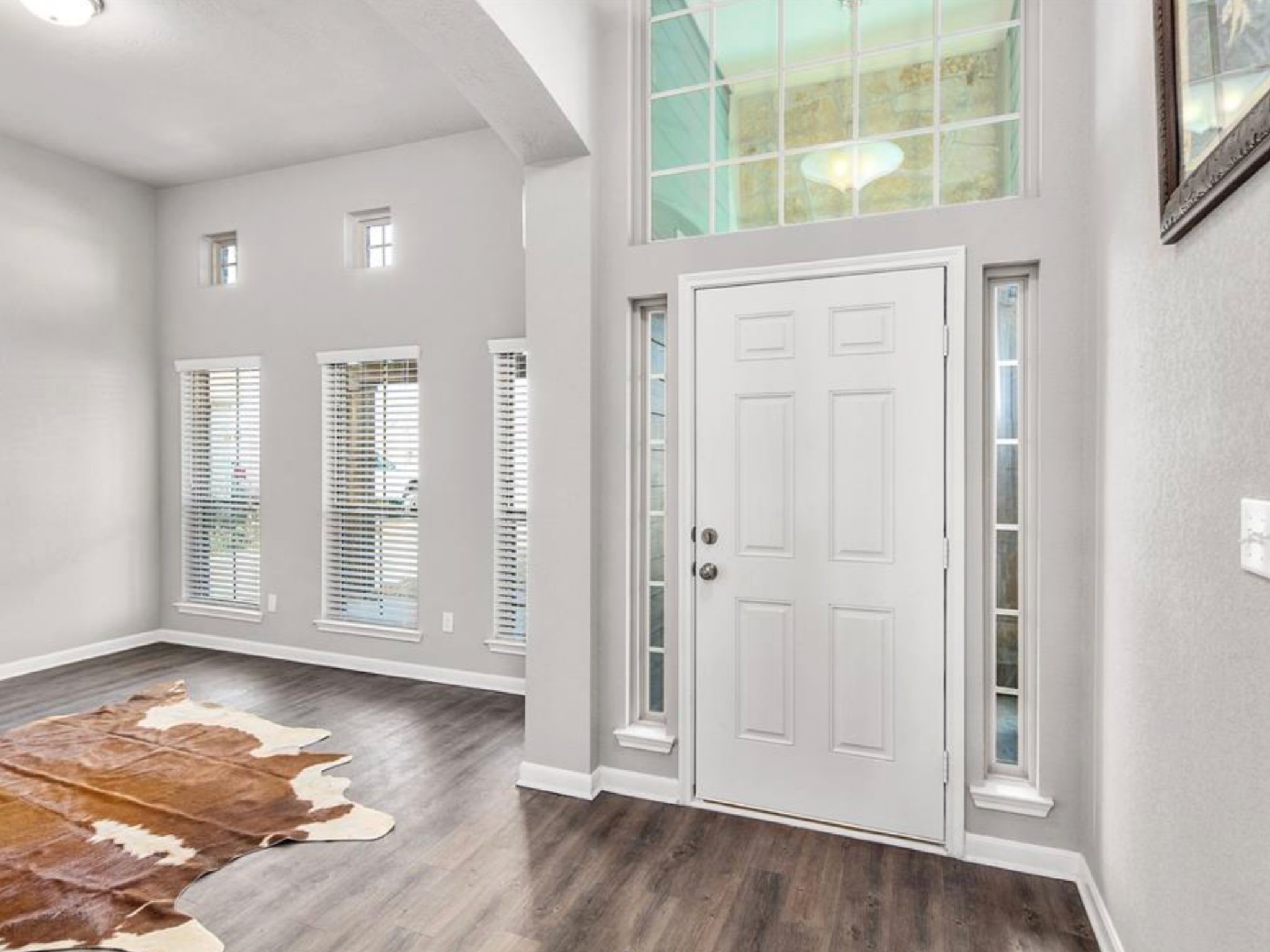 2025 Jester Trail Bryan, TX 77807 - Photo 5 of 24 an empty room with wooden floor and windows