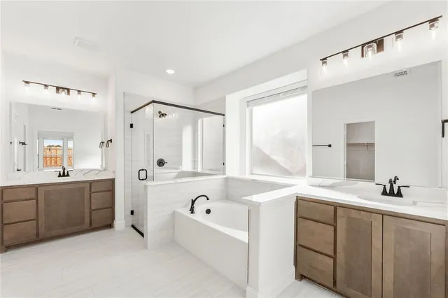 a bathroom with a bathtub and a shower