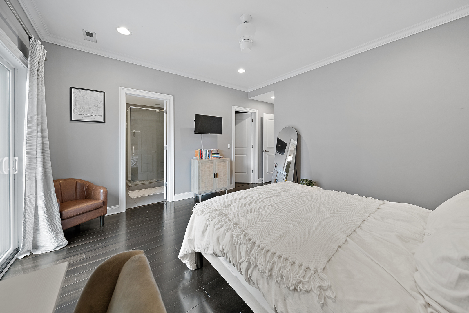 1041 West Madison Street, Unit 3 Chicago, IL 60607 - Photo 18 of 25 a bedroom with bed and a couch