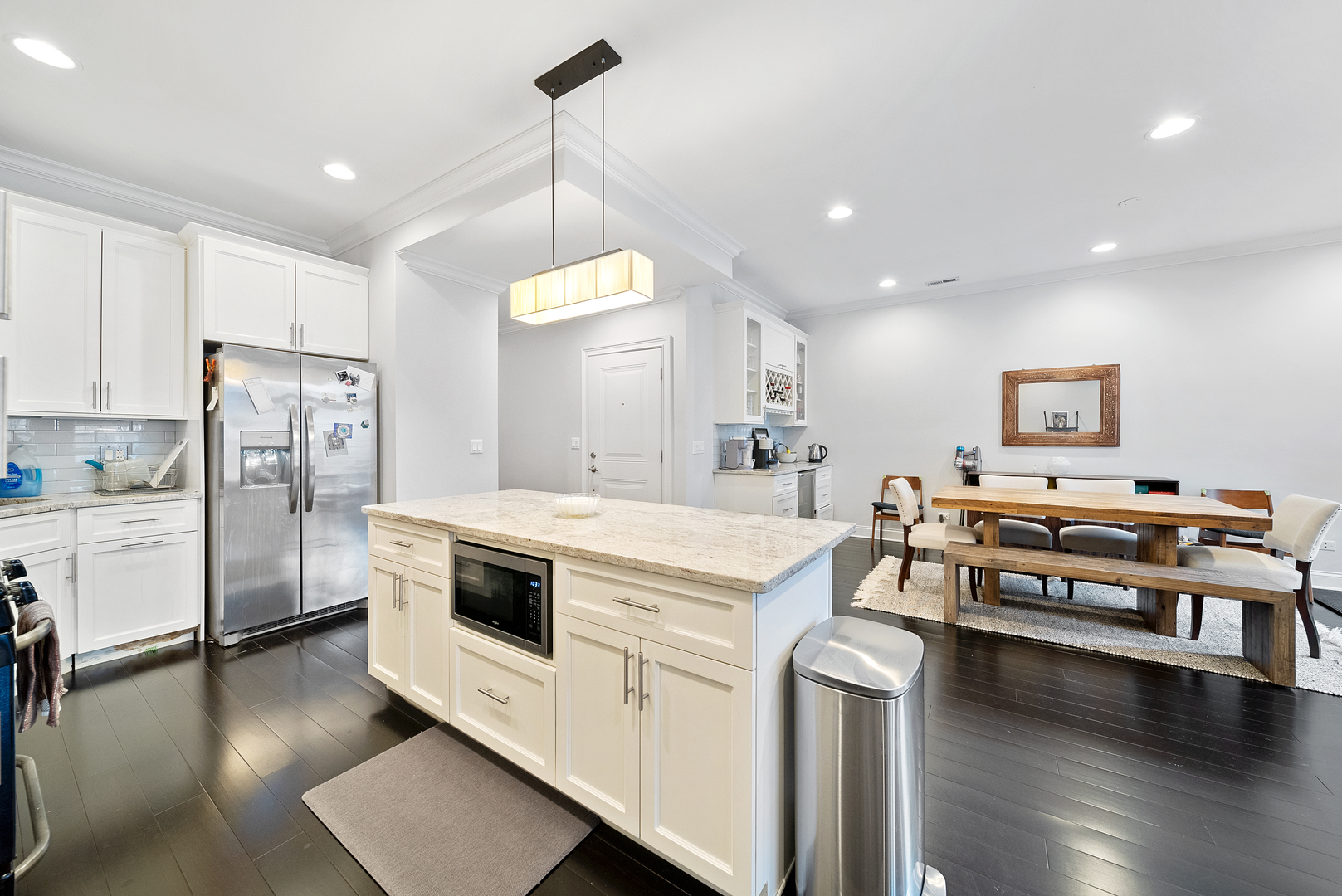 1041 West Madison Street, Unit 3 Chicago, IL 60607 - Photo 6 of 25 a kitchen with stainless steel appliances a stove a sink and a refrigerator