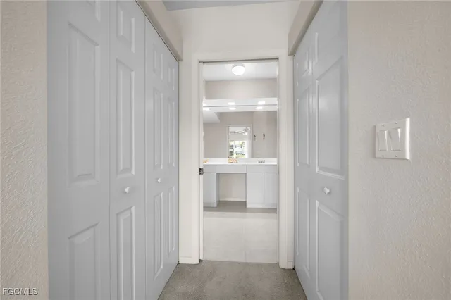 a bathroom with a double vanity sink mirror and