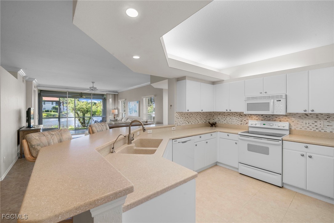 10831 Halfmoon Shoal Road, Unit 104 Estero, FL 34135 - Photo 17 of 49 a kitchen with sink and window